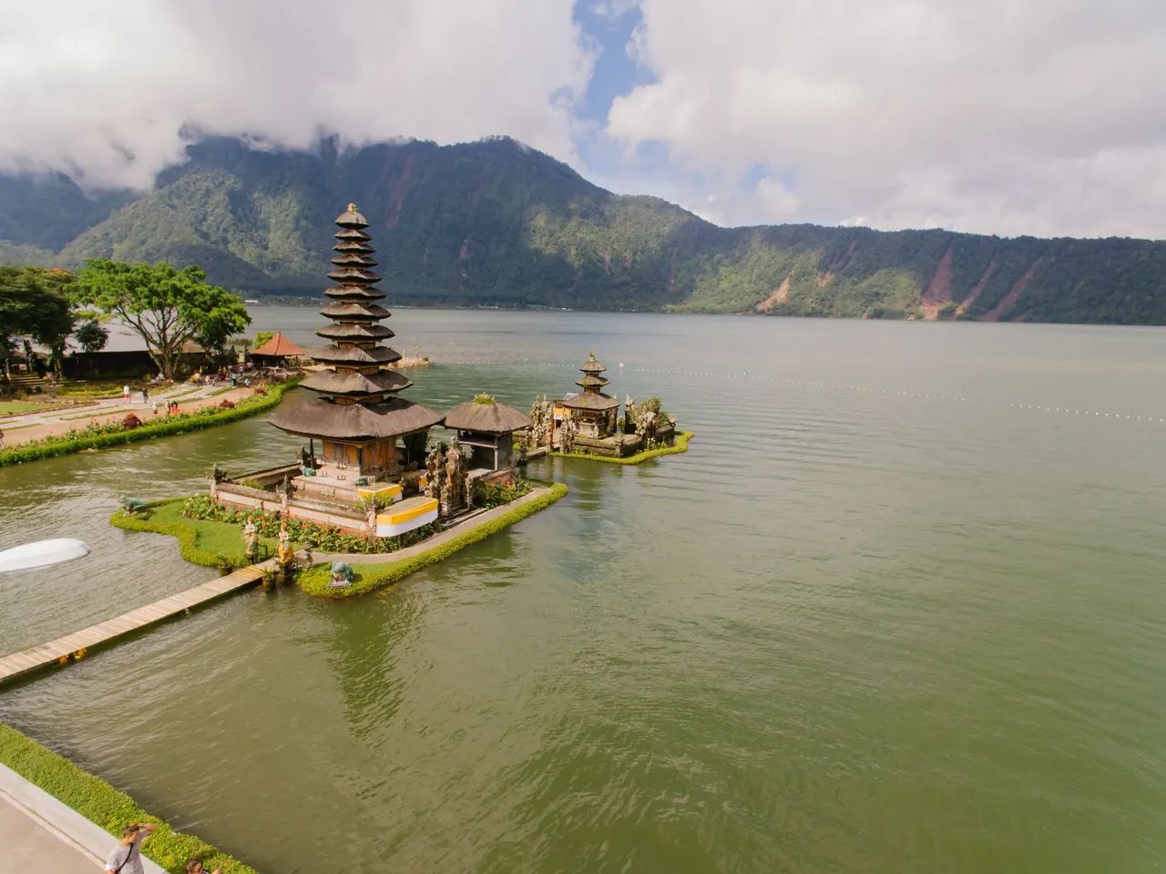 A stunning aerial view of Pura Ulun Danu Bratan Temple situated by a serene lake in the highlands of Bali, Indonesia.